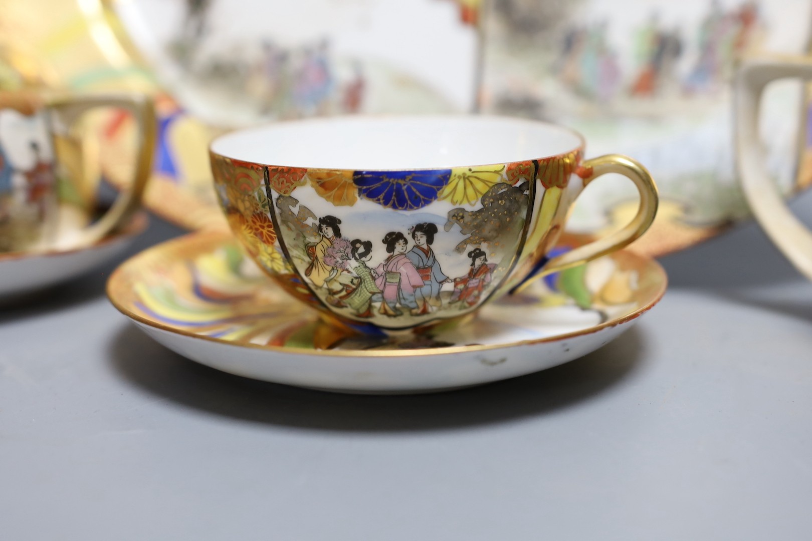 A Japanese Kutani porcelain teaset for 10 and a Japanese floral teapot